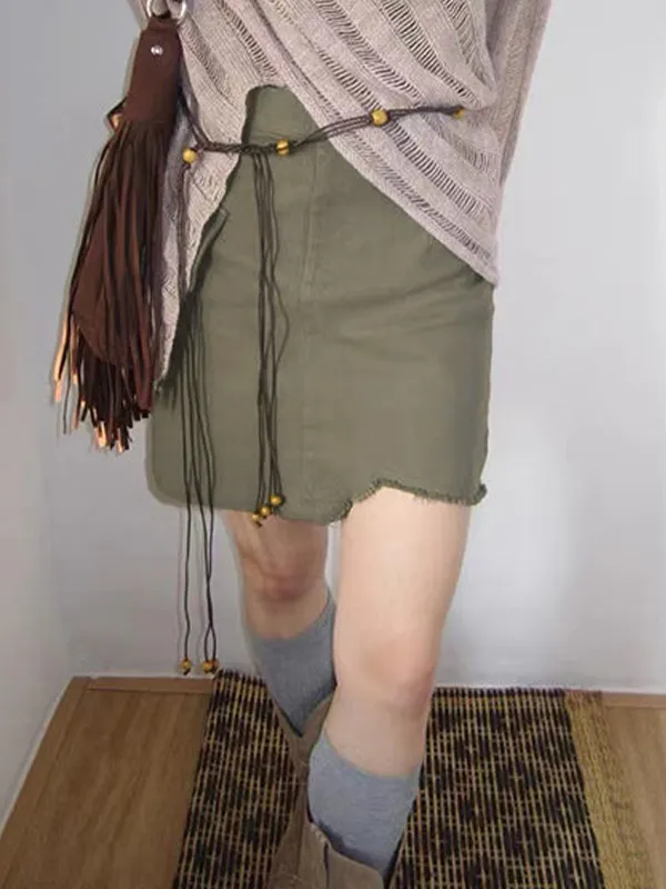 Minifalda adornada con bolsillo con dobladillo deshilachado irregular